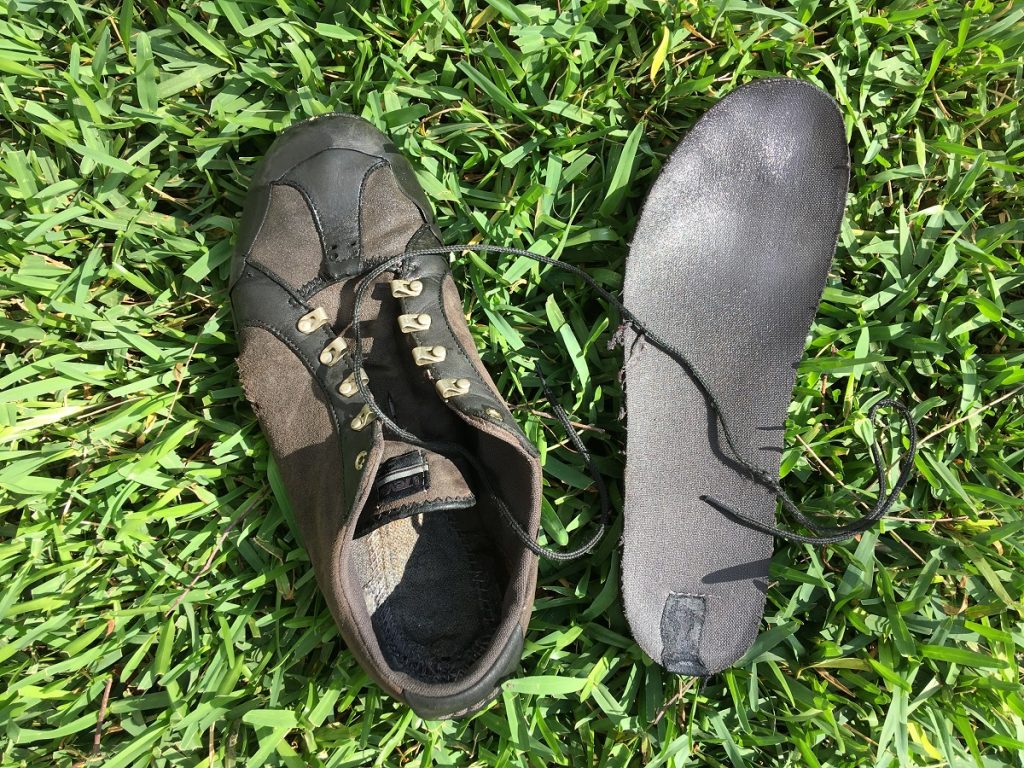 Insole and lace removed from wet shoe